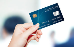 credit card in woman's hand